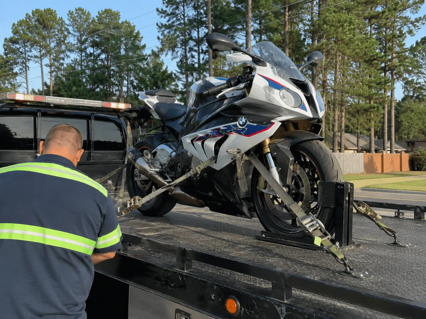 Motorcycle secured on a flatbed tow truck in Atascocita