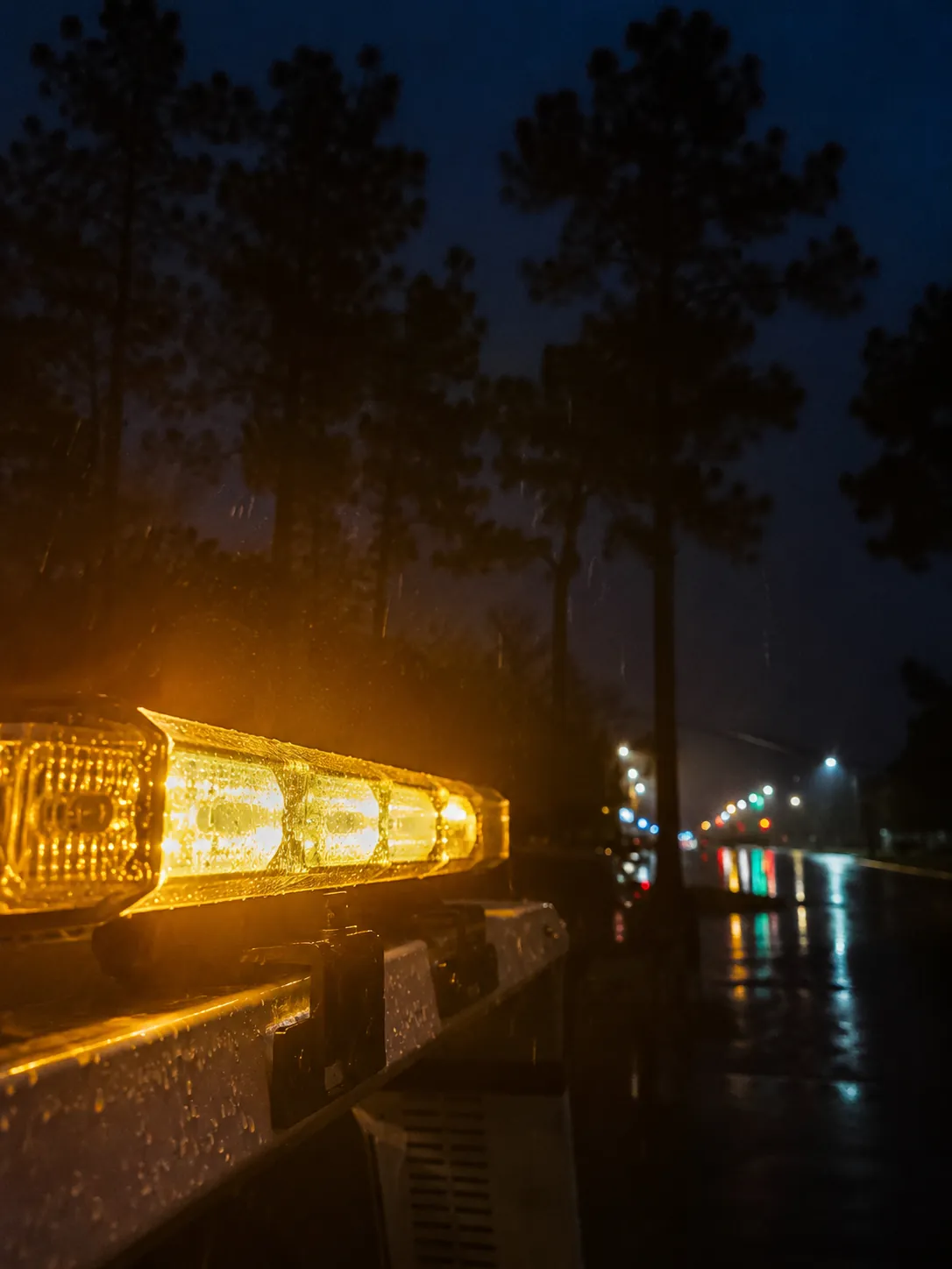 Tow truck amber warning lights at night in Humble TX